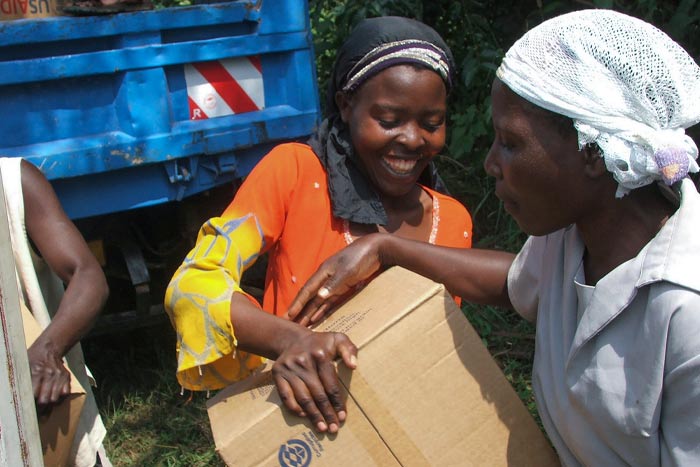 People receiving Breedlove food as part of international aid.