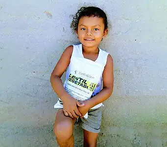 Little girl representative of those helped by the food that Breedlove distributes and provides.