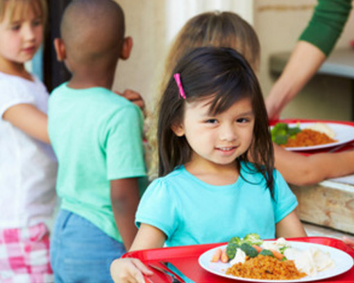 School Children Receiving Lunch Food From Breedlove